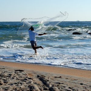 Guy throwing fishing net