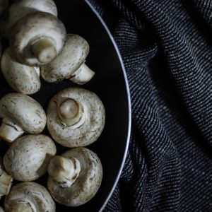 Button mushrooms in a pan