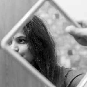 Girl looking into mirror