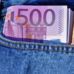 A roll of euros in a jeans pocket