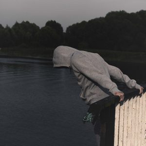 A man tries to jump from a bridge