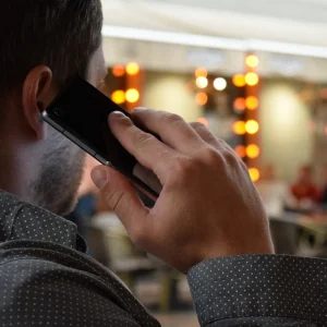 A man is talking on a cell phone