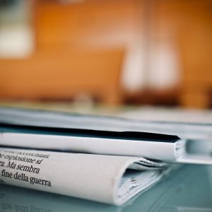 Folded up newspaper left on the desk