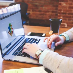 Profile picture of a woman working on a laptop