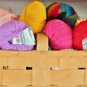 Woven wooden basket full of knitting