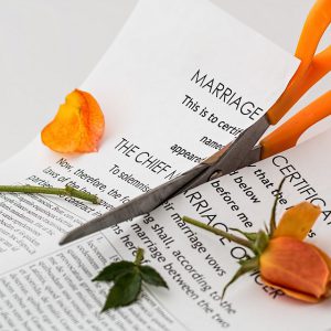 Marriage certificate cut in half with scissors